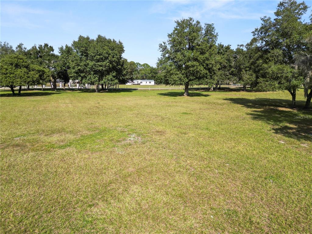 1828 Gator Creek Ranch Road Lakeland, FL 33809 - Photo 5 of 27 a view of a swimming pool and an outdoor space