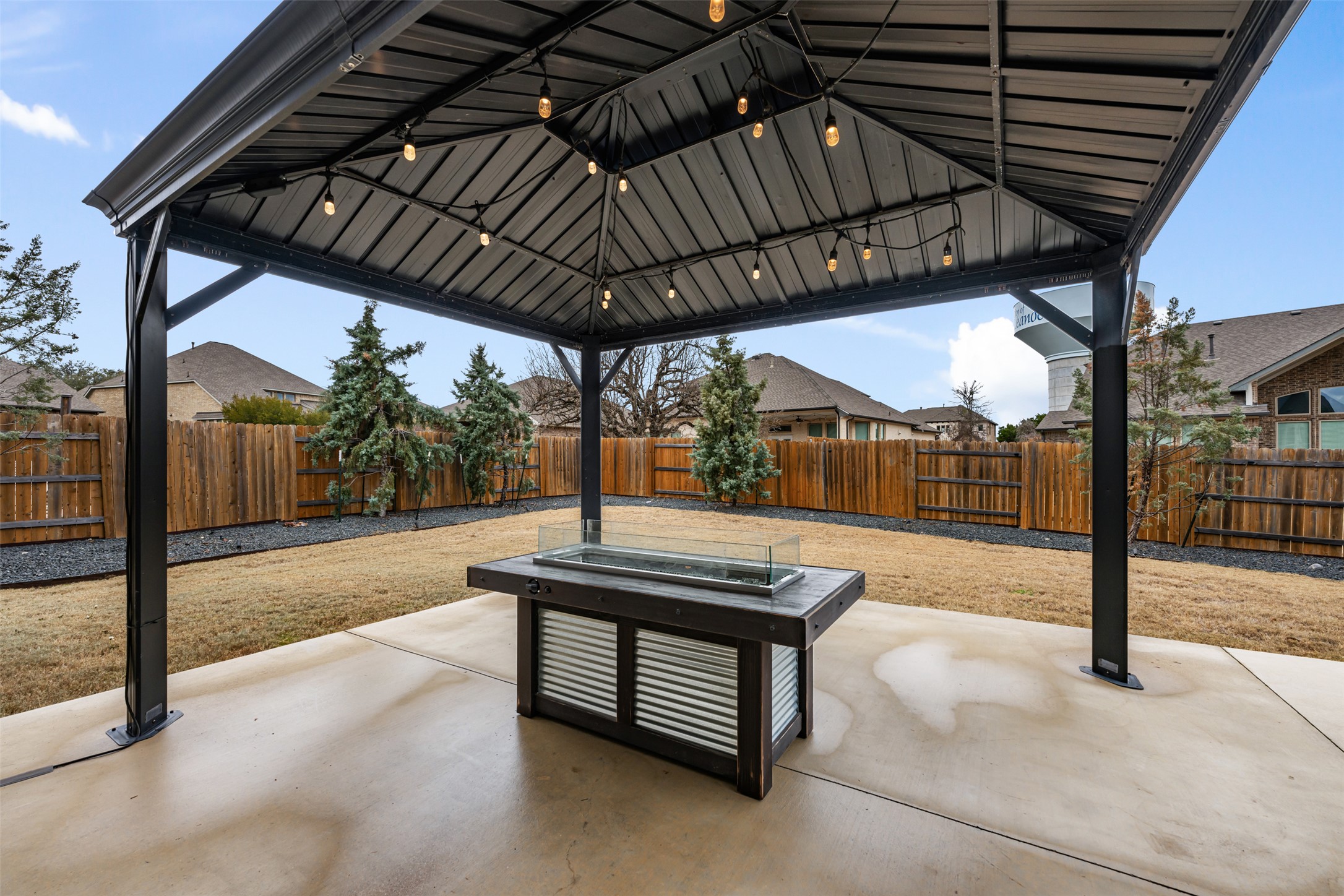 2501 Costera Street Leander, TX 78641 - Photo 29 of 40 Another gathering spot under this gazebo with a glass firepit.