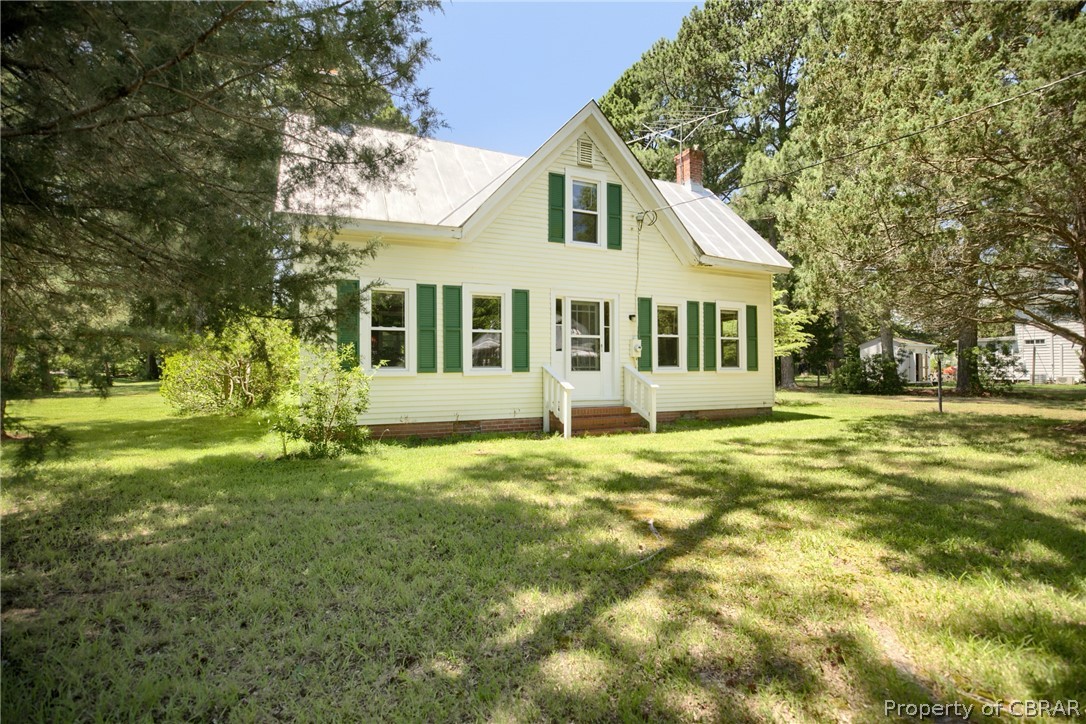 2442 Old Ferry Road Hudgins, VA 23076 - Photo 1 of 33 Back of house with a yard