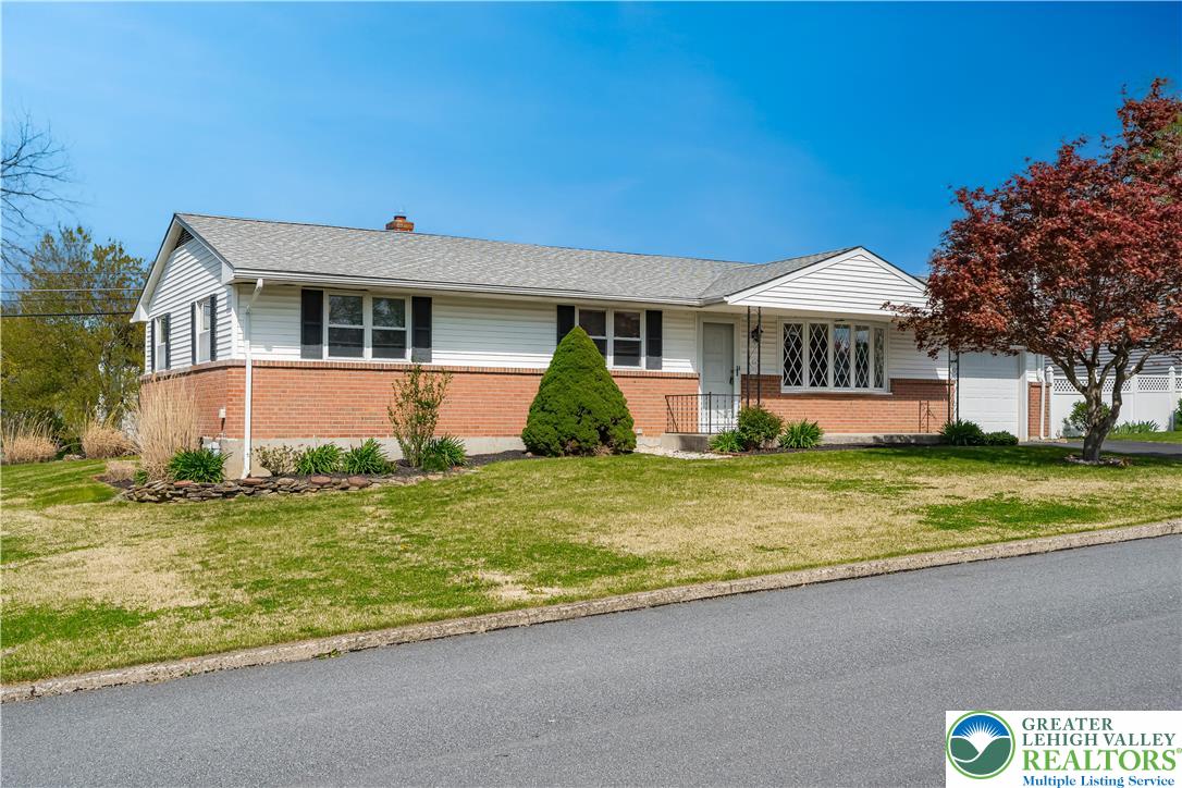 2141 Aster Road Lower Macungie Township, PA 18062 - Photo 1 of 62 a front view of a house with garden