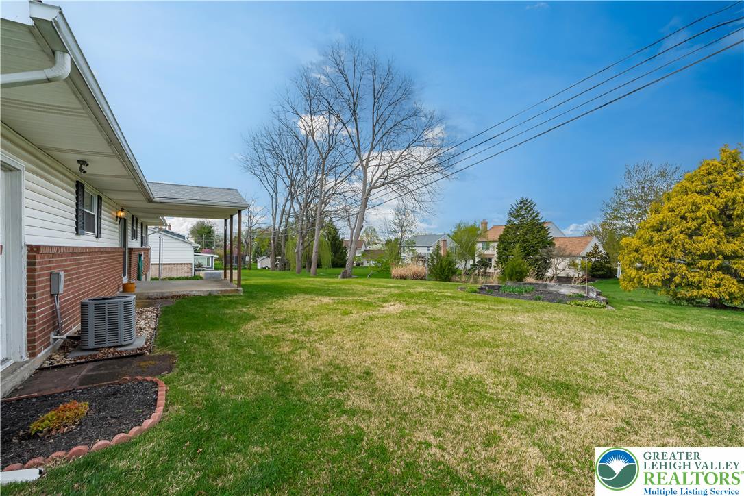 2141 Aster Road Lower Macungie Township, PA 18062 - Photo 16 of 62 a view of a house with a yard