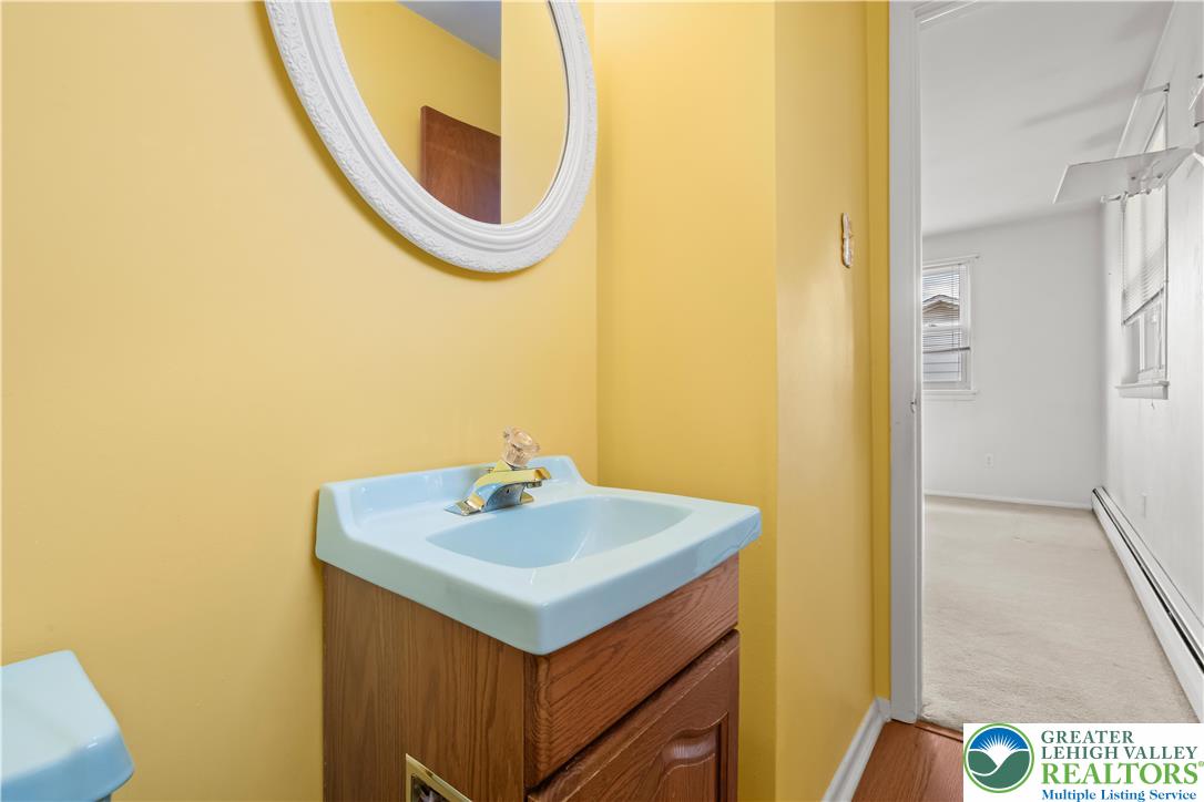 2141 Aster Road Lower Macungie Township, PA 18062 - Photo 42 of 62 a bathroom with a sink and a mirror