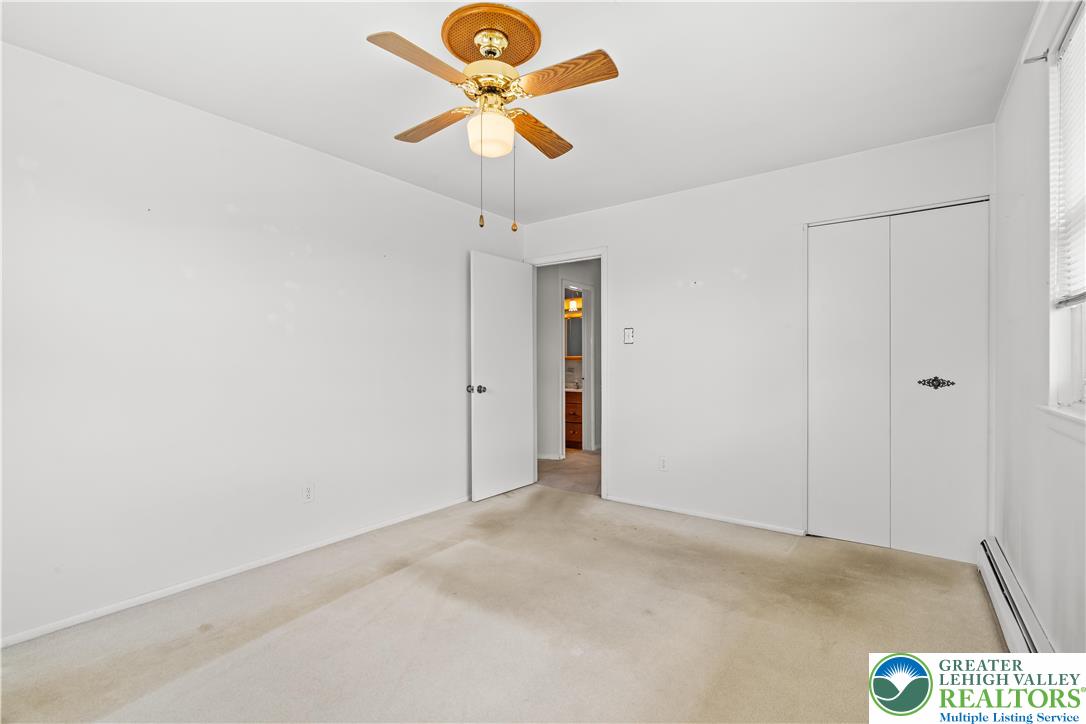 2141 Aster Road Lower Macungie Township, PA 18062 - Photo 44 of 62 an empty room with a chandelier fan and a ceiling fan
