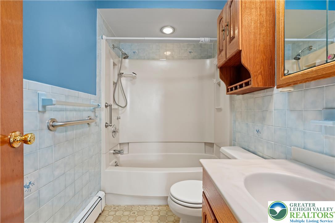 2141 Aster Road Lower Macungie Township, PA 18062 - Photo 48 of 62 a bathroom with a bathtub and a shower