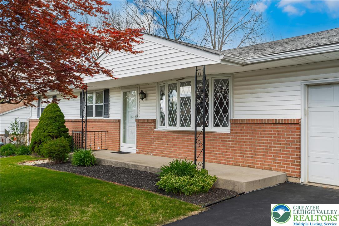 2141 Aster Road Lower Macungie Township, PA 18062 - Photo 6 of 62 a front view of a house with garden