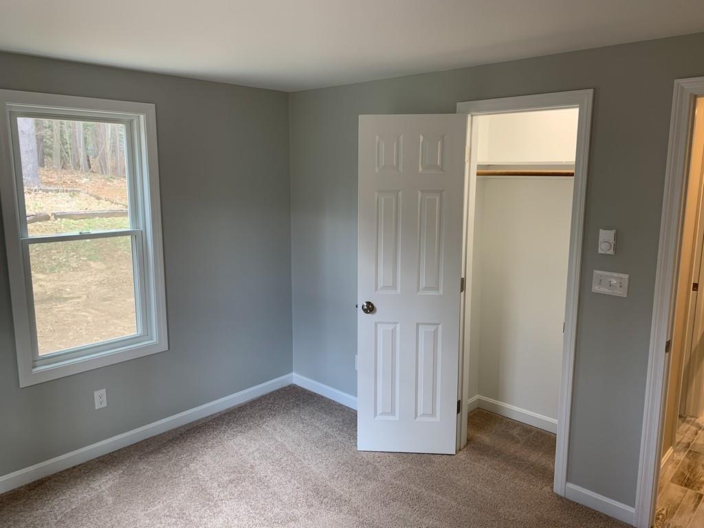 77 May Brook Road Holland, MA 01521 - Photo 18 of 23 a view of an empty room with a window