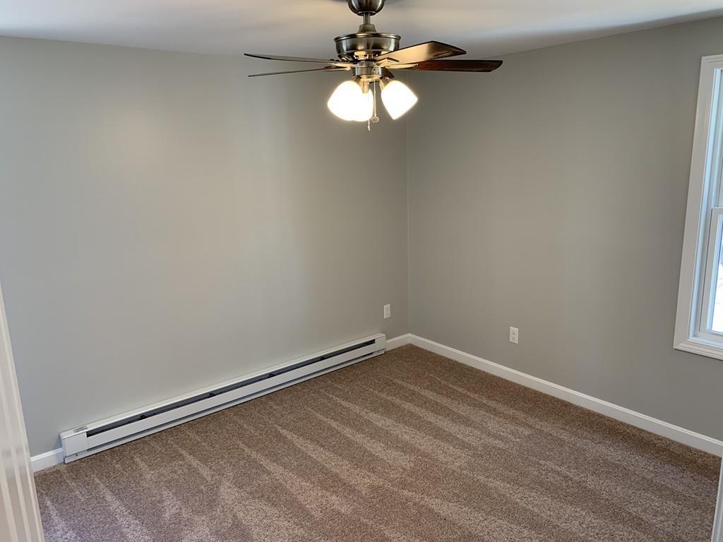 77 May Brook Road Holland, MA 01521 - Photo 19 of 23 a view of empty room with window and ceiling fan