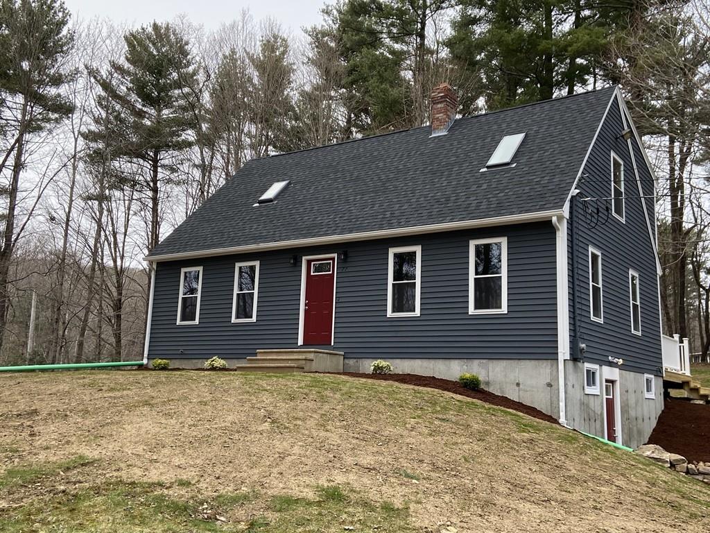 77 May Brook Road Holland, MA 01521 - Photo 3 of 23 a front view of a house with a yard