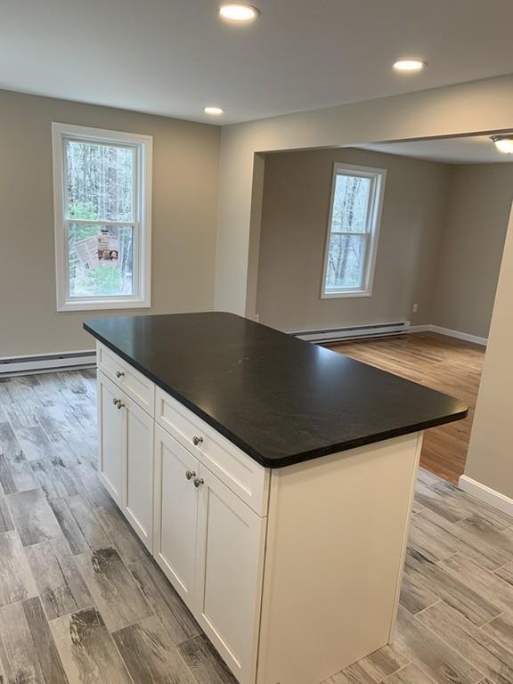 77 May Brook Road Holland, MA 01521 - Photo 8 of 23 a kitchen with granite countertop a sink and a stove top oven