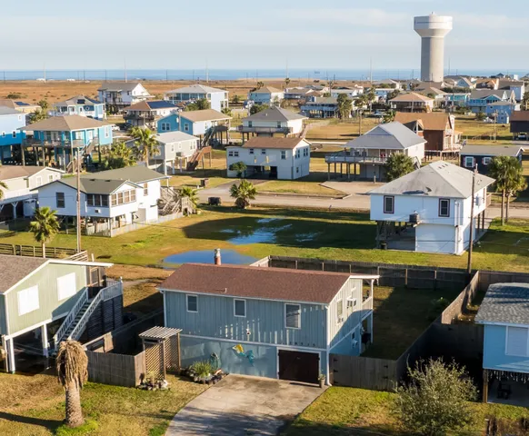 an aerial view of residential building and parking space