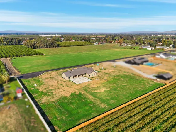 a view of a field with an ocean