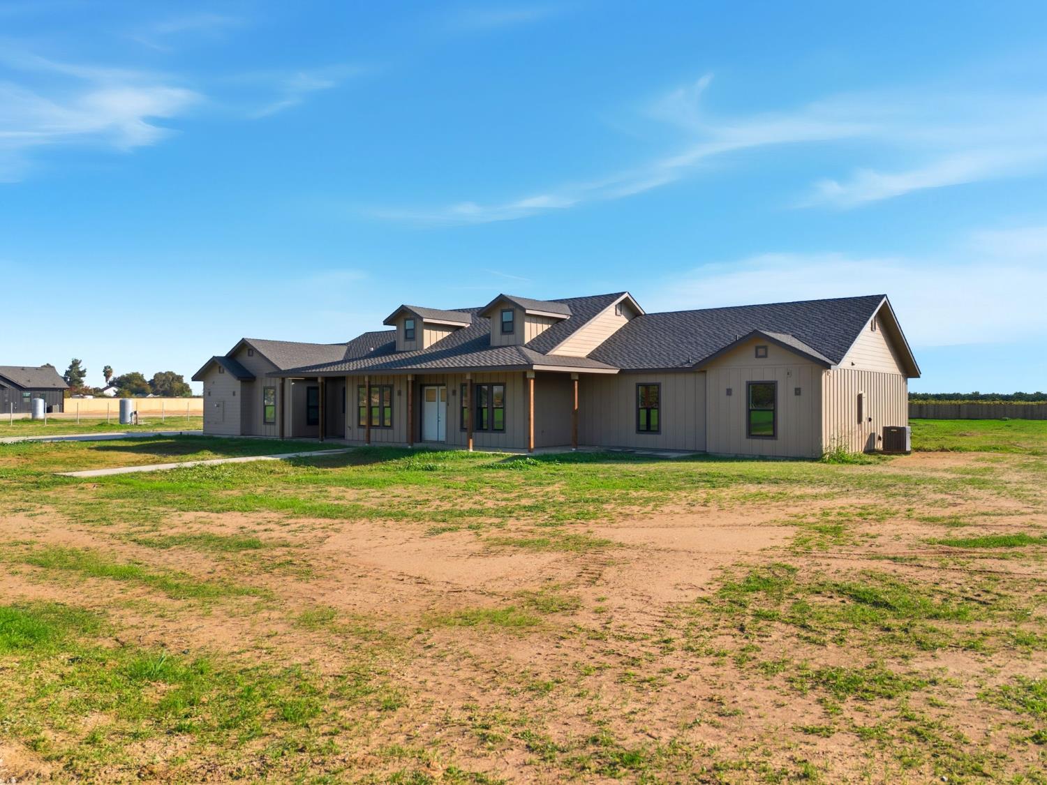 605 South Anderson Road Exeter, CA 93221 - Photo 6 of 13 a front view of a house with a garden
