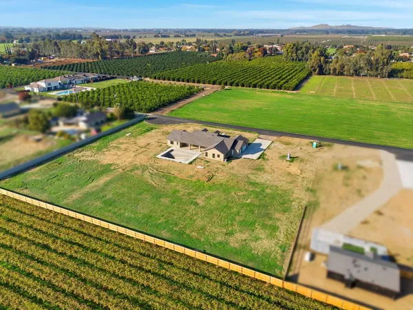 an aerial view of a golf course with a big yard