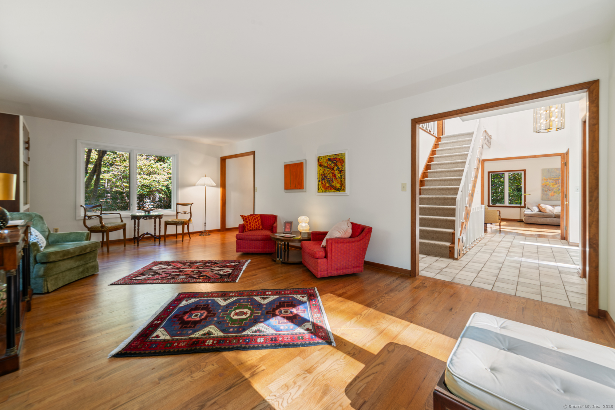 34 Echo Valley Road Newtown, CT 06470 - Photo 12 of 40 a living room with furniture and a wooden floor
