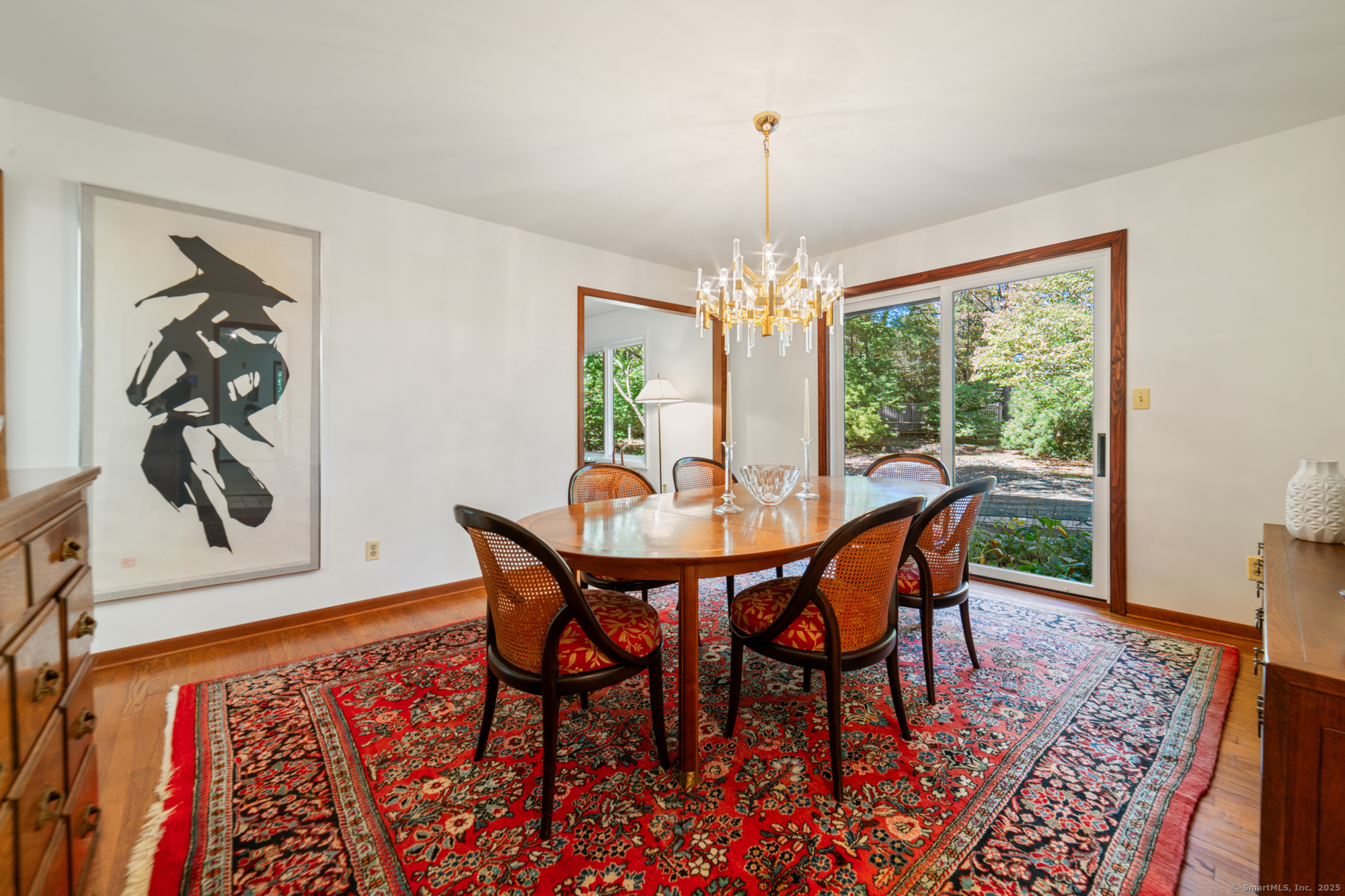 34 Echo Valley Road Newtown, CT 06470 - Photo 15 of 40 a view of a dining room with furniture window and wooden floor
