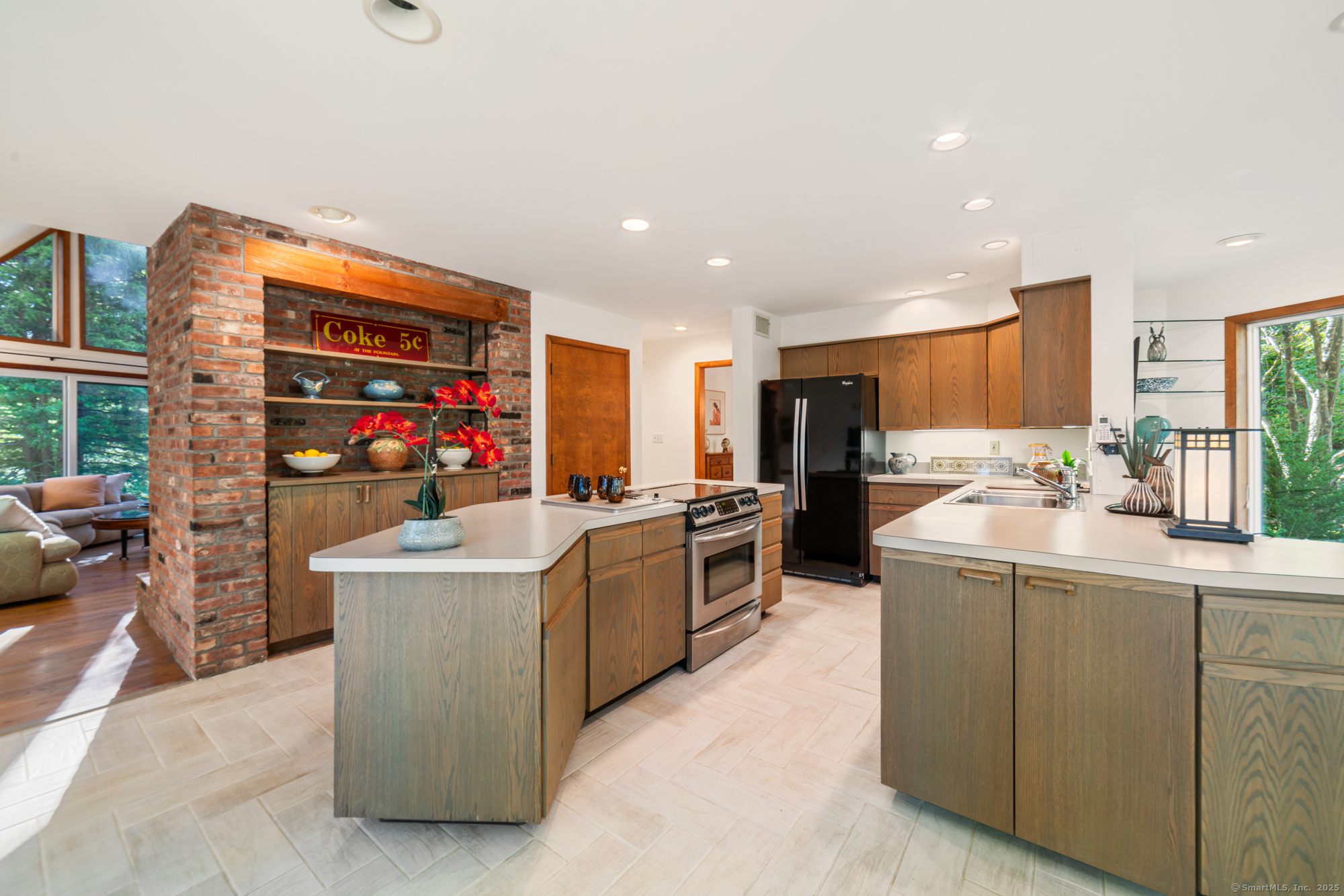 34 Echo Valley Road Newtown, CT 06470 - Photo 16 of 40 a kitchen with stainless steel appliances kitchen island granite countertop a stove and a refrigerator