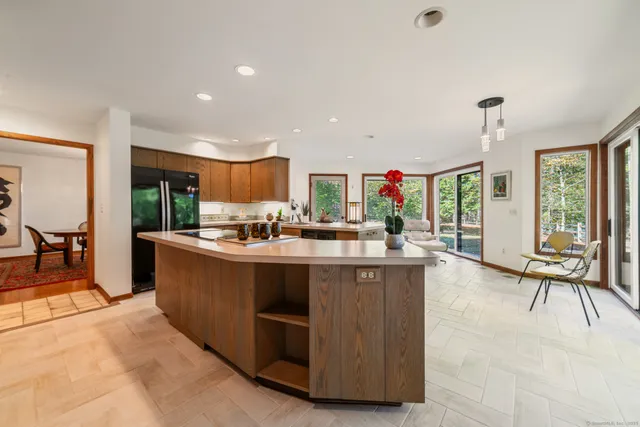 a view of living room with granite countertop furniture and a large window