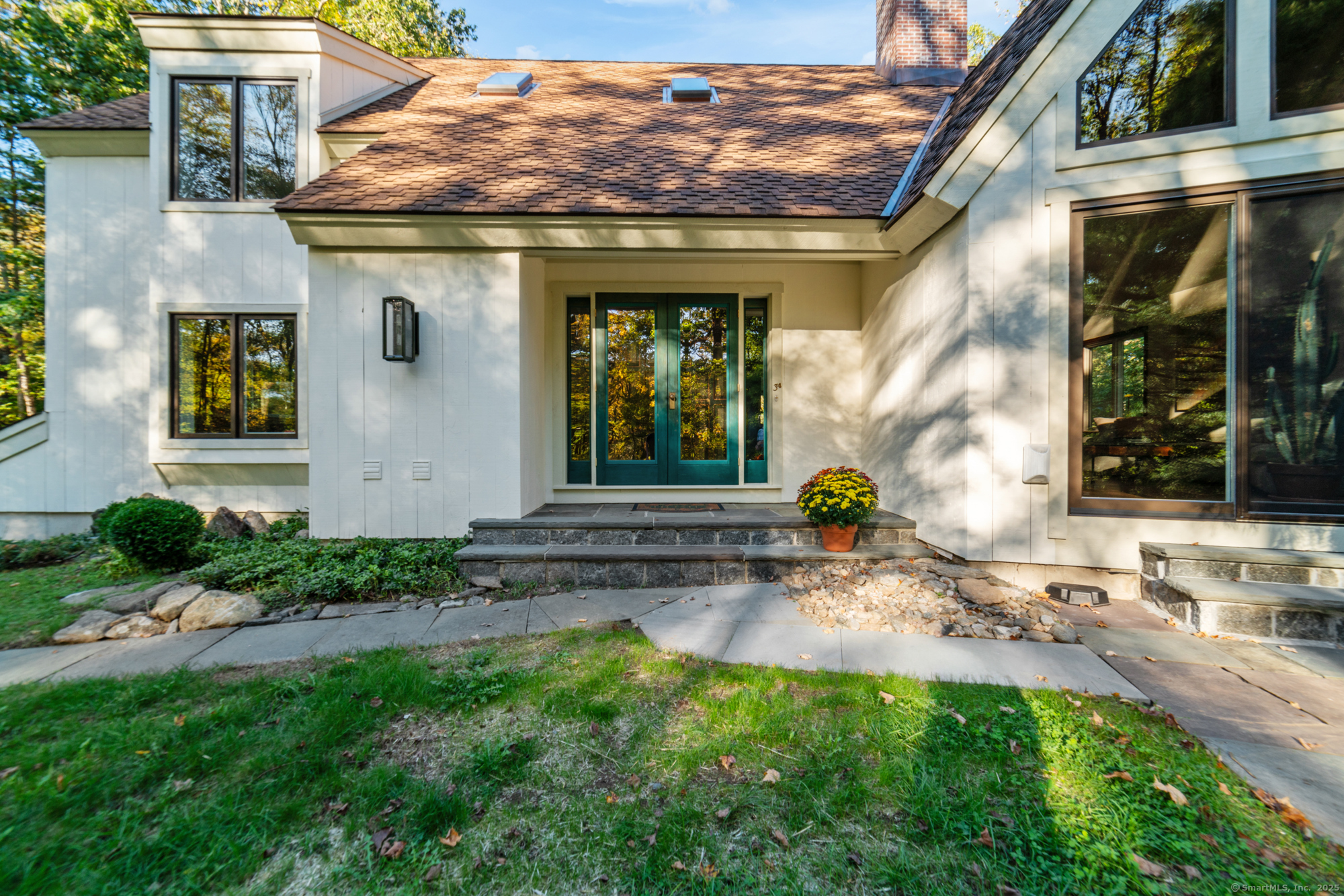 34 Echo Valley Road Newtown, CT 06470 - Photo 2 of 40 a view of a house with a small yard and plants