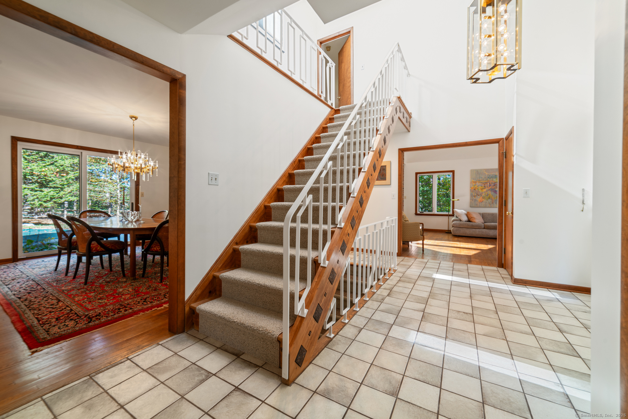 34 Echo Valley Road Newtown, CT 06470 - Photo 21 of 40 a view of entryway and hall with dining room