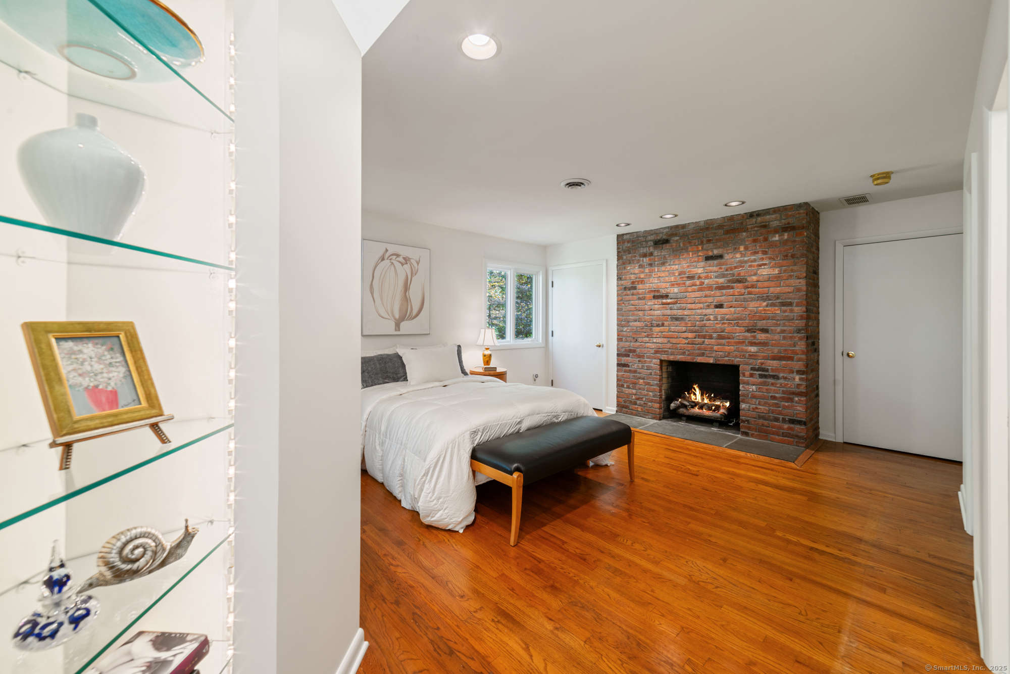 34 Echo Valley Road Newtown, CT 06470 - Photo 24 of 40 a living room with furniture and a fireplace