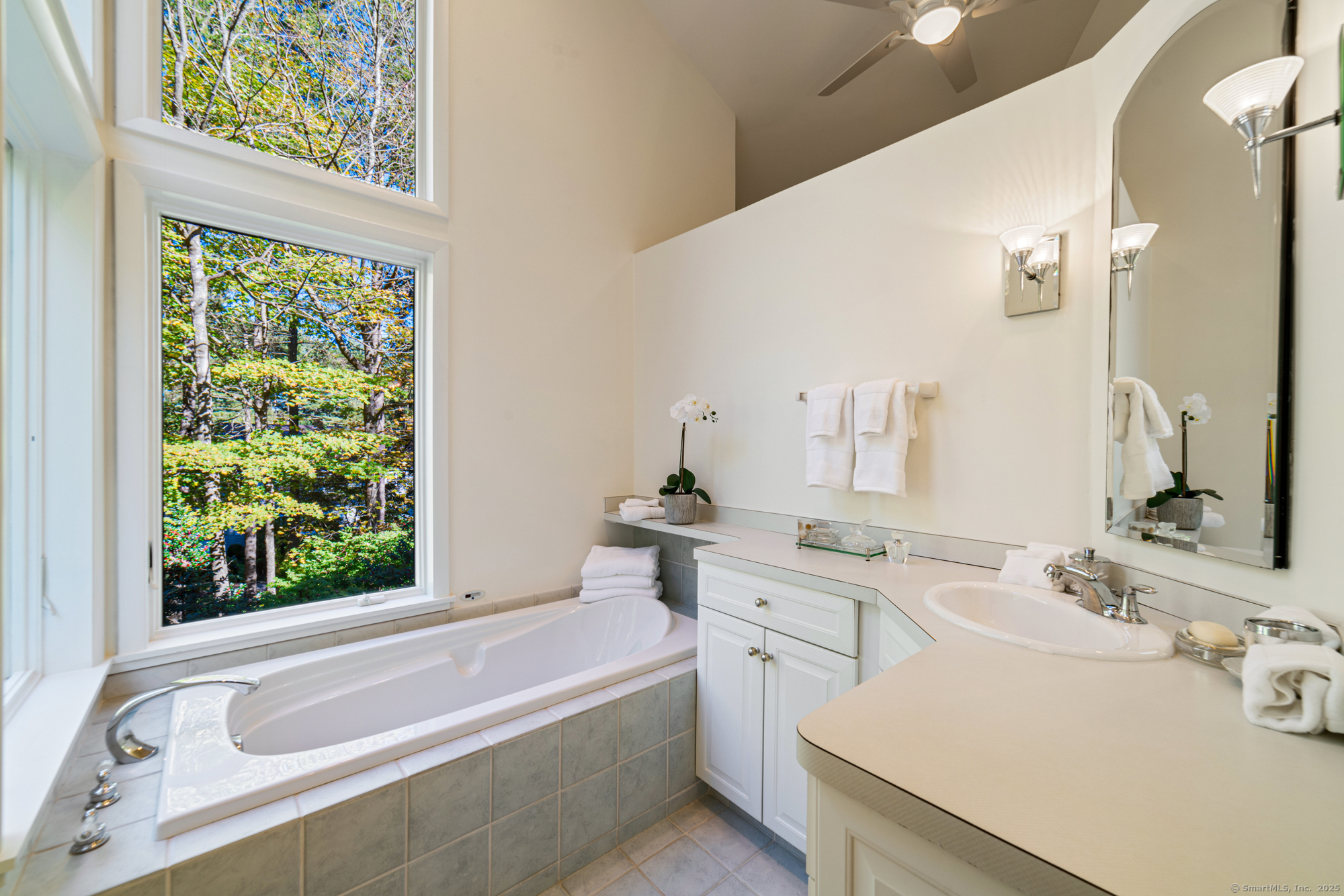 34 Echo Valley Road Newtown, CT 06470 - Photo 25 of 40 a bathroom with a tub sink and mirror