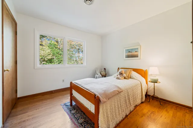 a bed room with a bed and a window