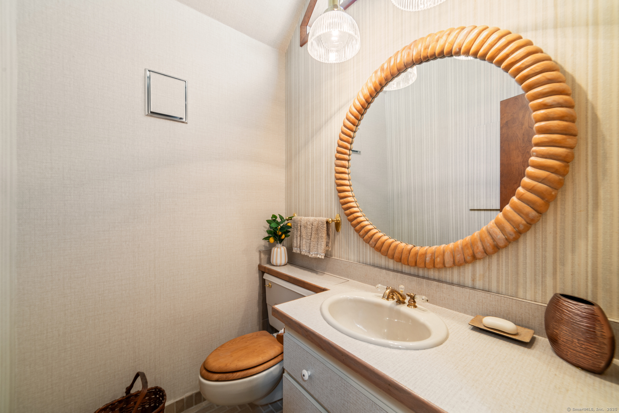 34 Echo Valley Road Newtown, CT 06470 - Photo 32 of 40 a bathroom with a sink and a mirror