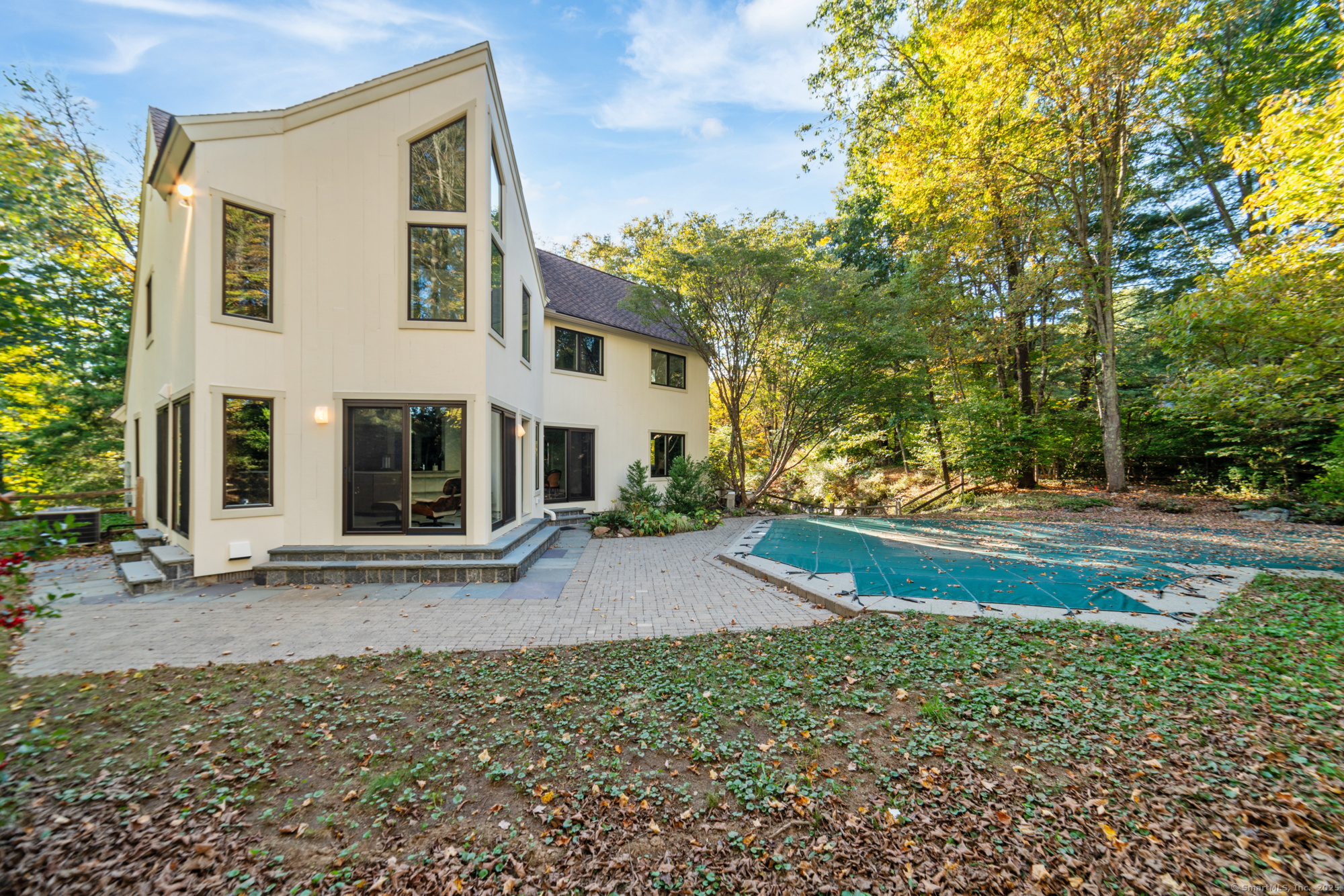 34 Echo Valley Road Newtown, CT 06470 - Photo 37 of 40 a view of a house with backyard and trees