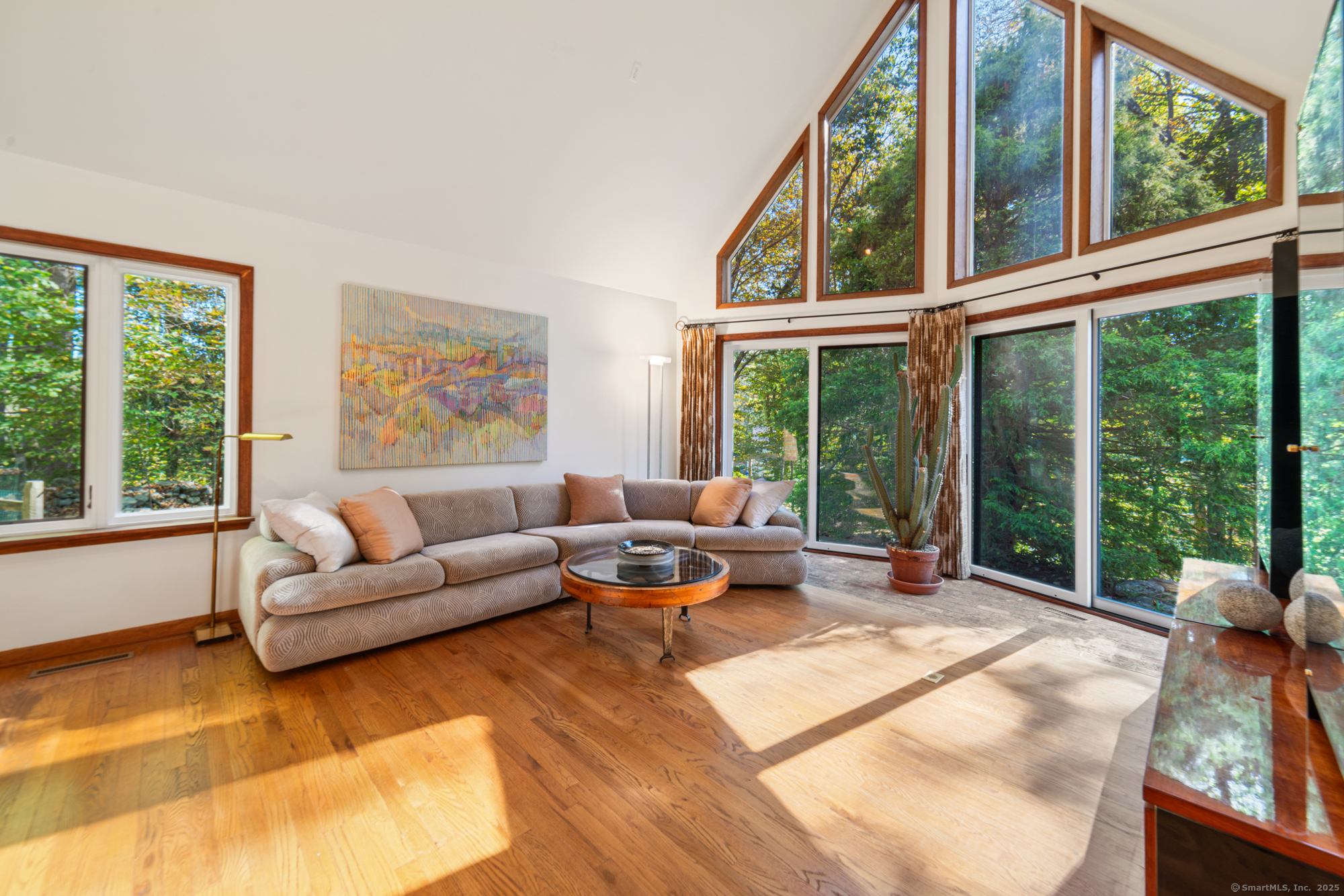 34 Echo Valley Road Newtown, CT 06470 - Photo 8 of 40 a living room with furniture and large windows
