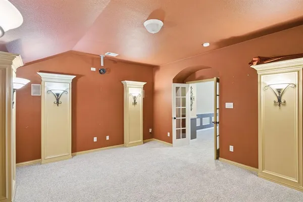 a spacious bathroom with a granite countertop sink and a large mirror