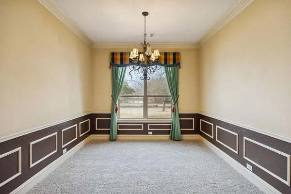 a view of a bedroom with wooden floor and bathroom