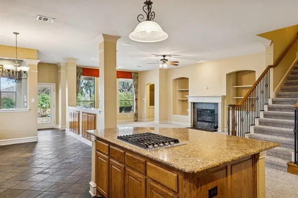 a kitchen with stainless steel appliances granite countertop a stove and a center island