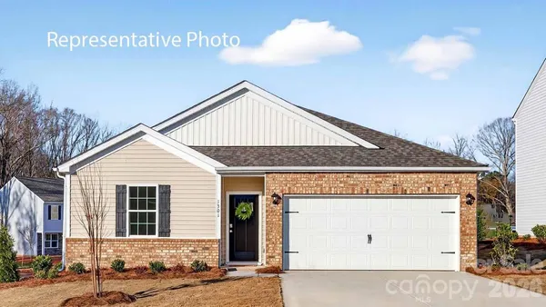 a front view of a house with a garage