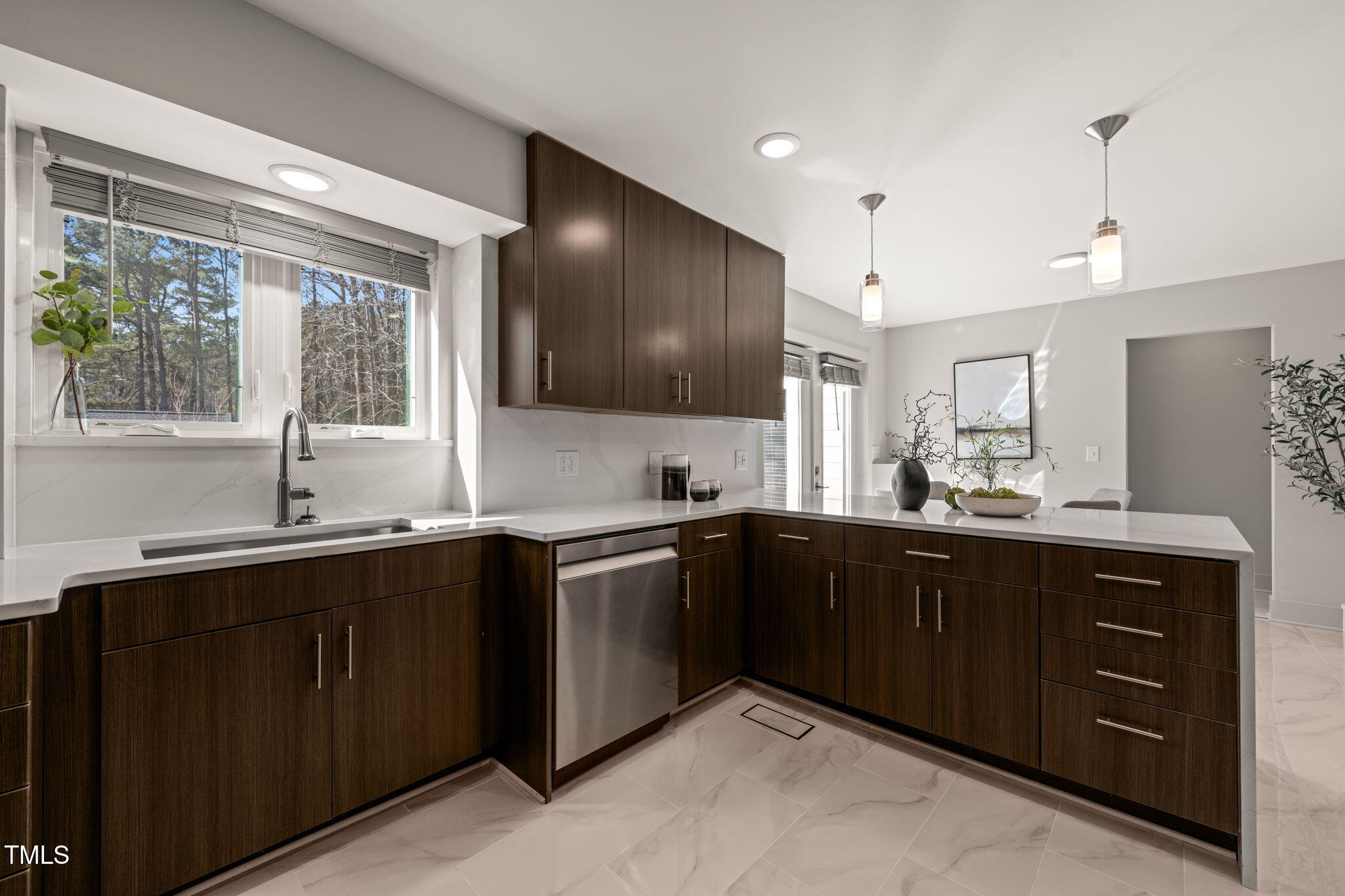 11801 Old Creedmoor Road Raleigh, NC 27613 - Photo 12 of 52 a kitchen with lots of counter space and a sink