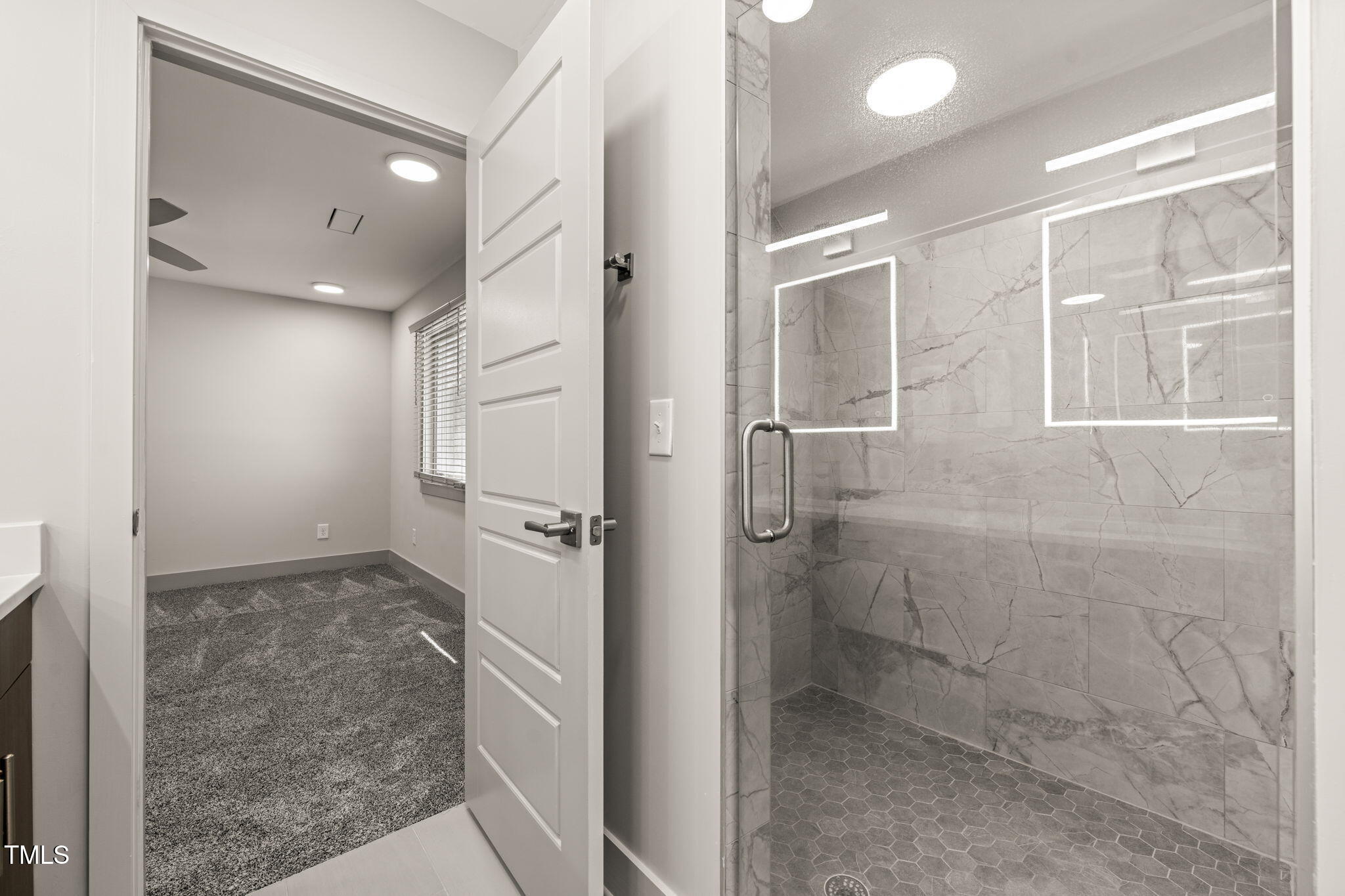 11801 Old Creedmoor Road Raleigh, NC 27613 - Photo 26 of 52 a bathroom with a shower and a glass door