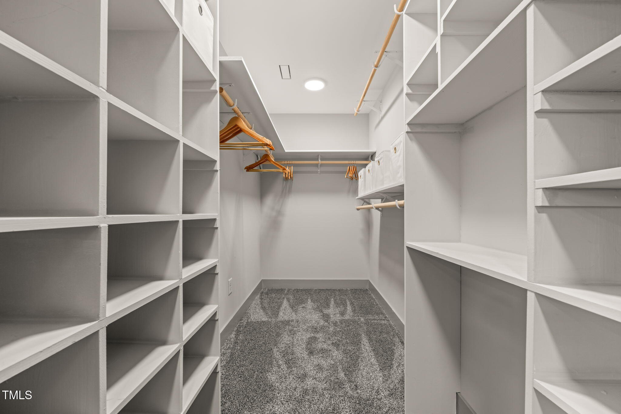 11801 Old Creedmoor Road Raleigh, NC 27613 - Photo 27 of 52 a view of walk in closet with empty racks
