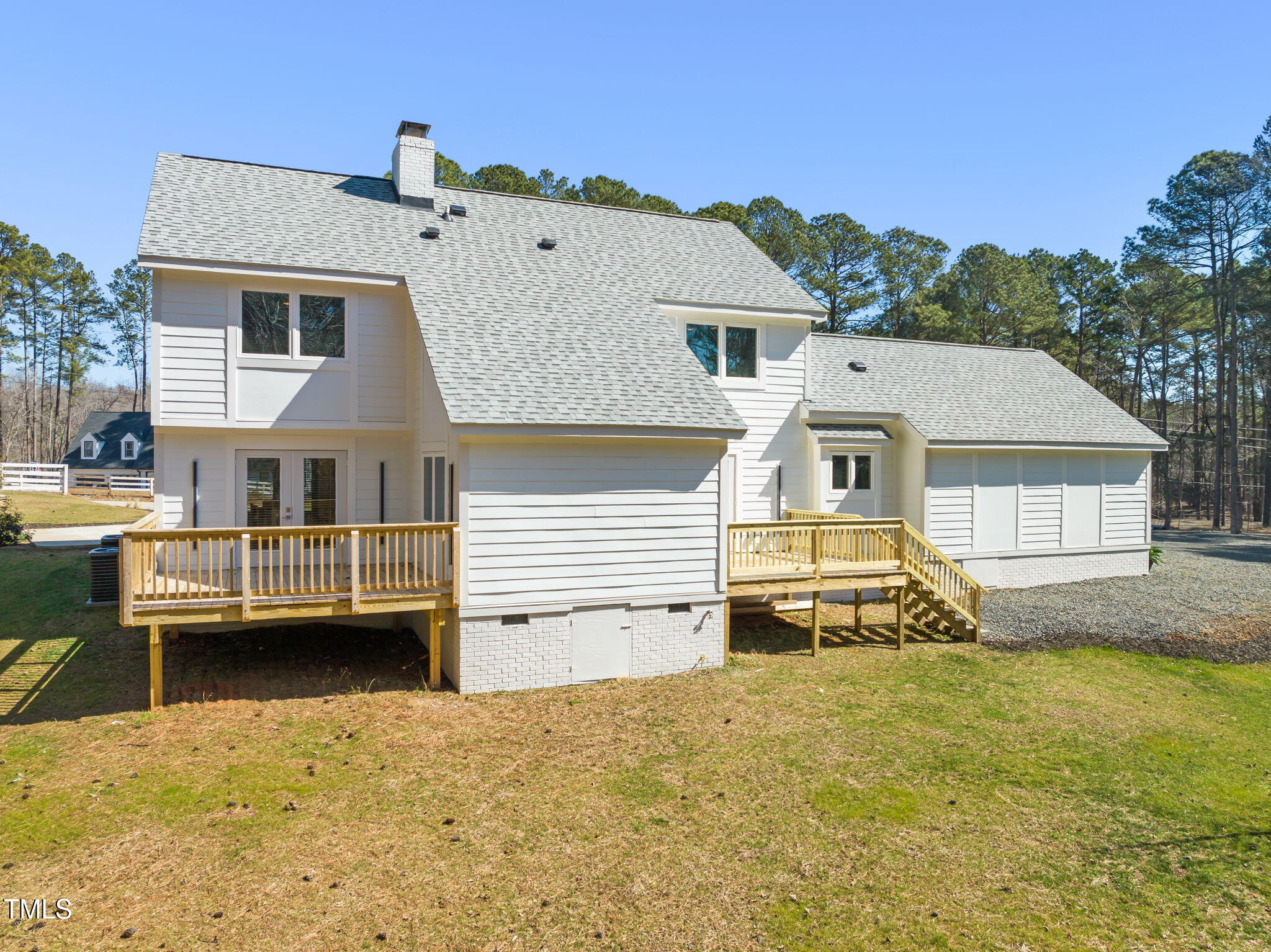 11801 Old Creedmoor Road Raleigh, NC 27613 - Photo 39 of 52 a view of a house with a barbeque and wooden stairs
