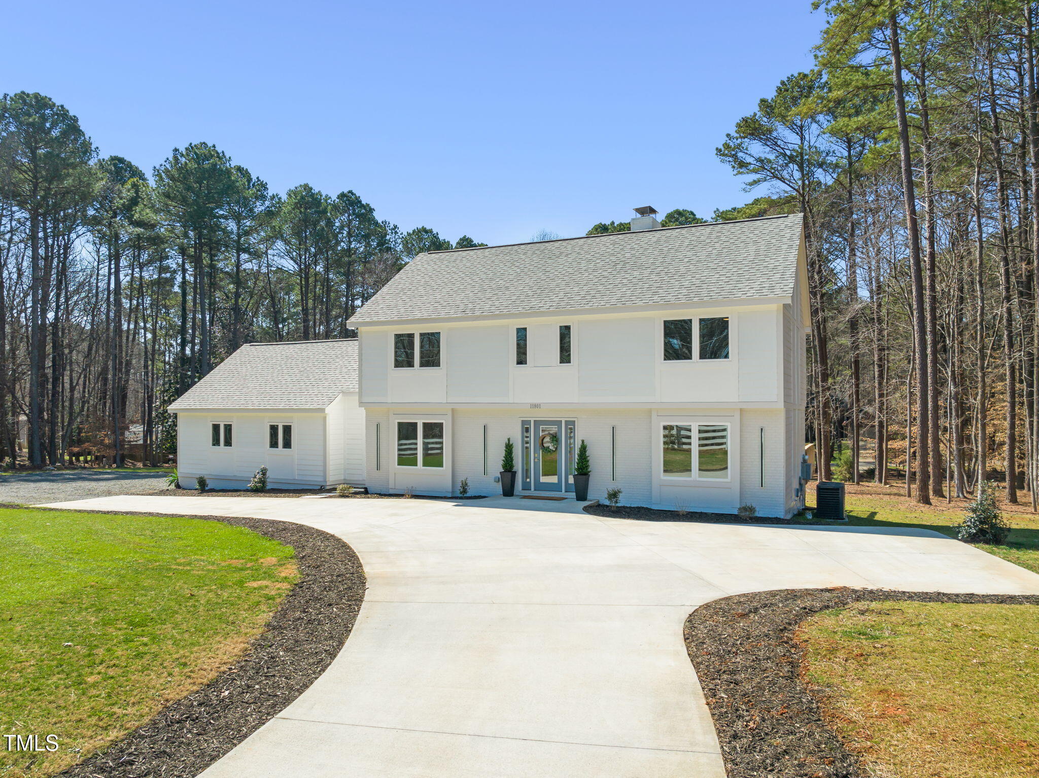 11801 Old Creedmoor Road Raleigh, NC 27613 - Photo 44 of 52 a front view of a house with a yard