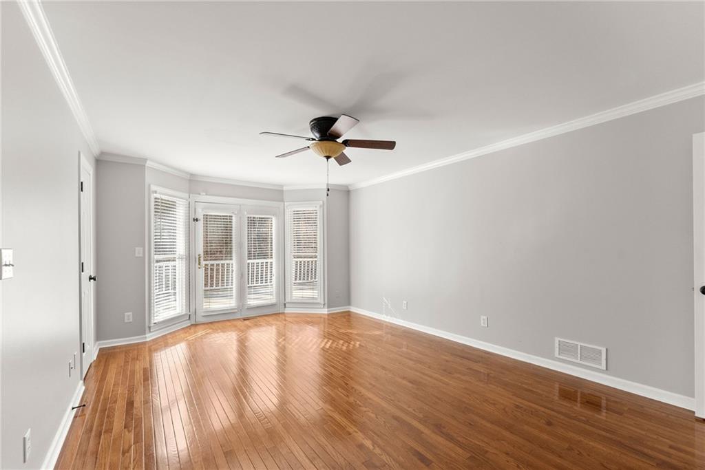3523 Lighthouse Lane Gainesville, GA 30504 - Photo 22 of 72 a view of an empty room with wooden floor and a window