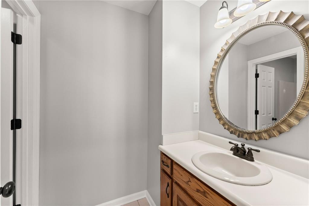 3523 Lighthouse Lane Gainesville, GA 30504 - Photo 36 of 72 a bathroom with a sink and a mirror