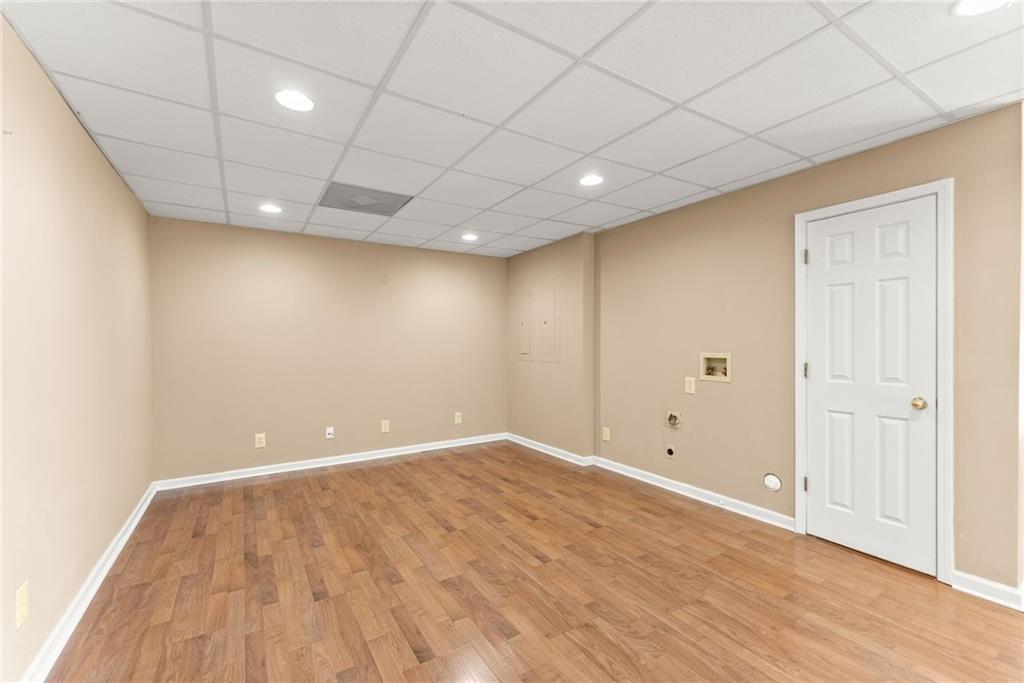 3523 Lighthouse Lane Gainesville, GA 30504 - Photo 50 of 72 an empty room with wooden floor and natural light