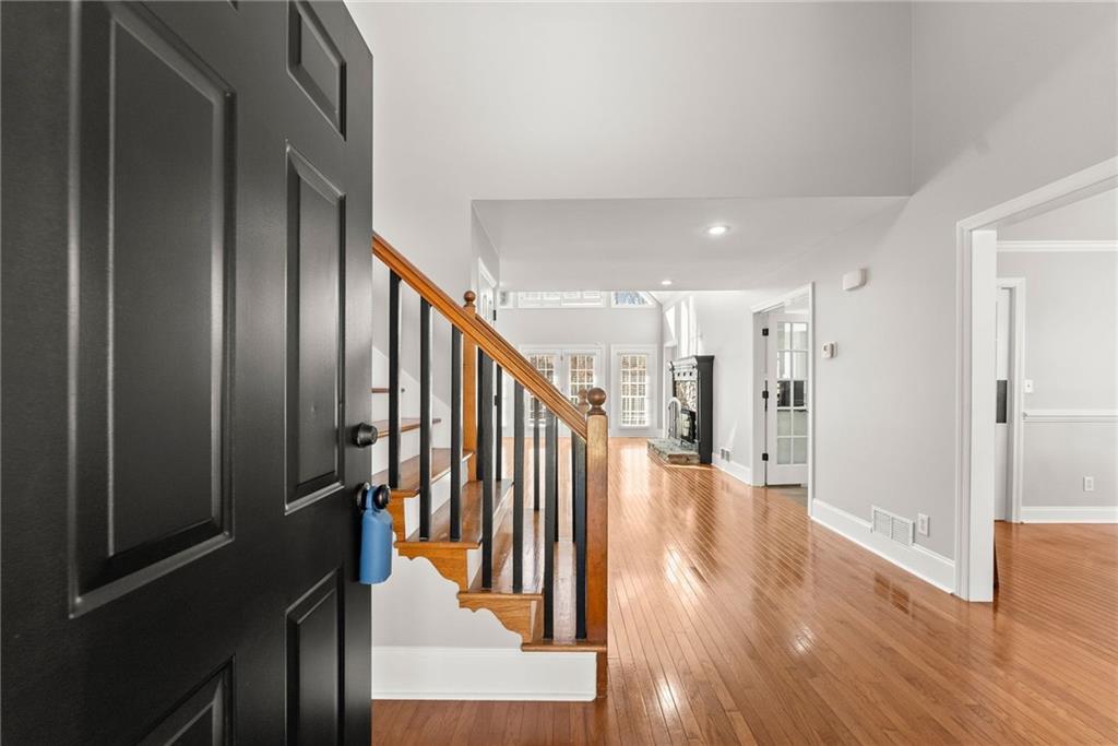 3523 Lighthouse Lane Gainesville, GA 30504 - Photo 7 of 72 a view of a hallway with wooden floor and staircase