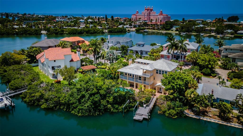 an aerial view of a house with outdoor space and lake view