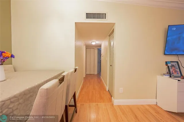 a view of a room that has a bed in it