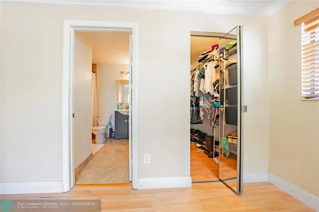 a view of a livingroom with wooden floor and a livingroom