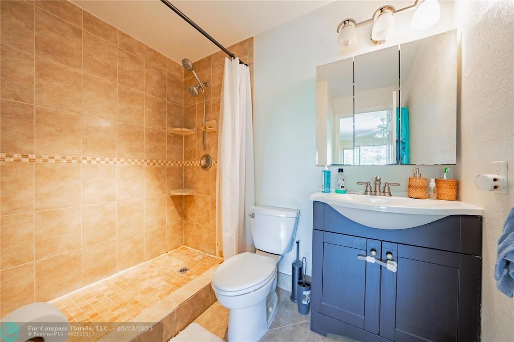 9614 West McNab Road, Unit 204 Tamarac, FL 33321 - Photo 17 of 37 a bathroom with a sink toilet and shower