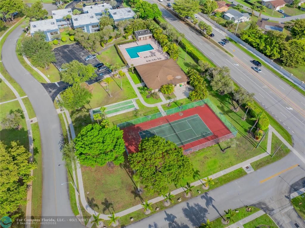 9614 West McNab Road, Unit 204 Tamarac, FL 33321 - Photo 26 of 37 an aerial view of a city