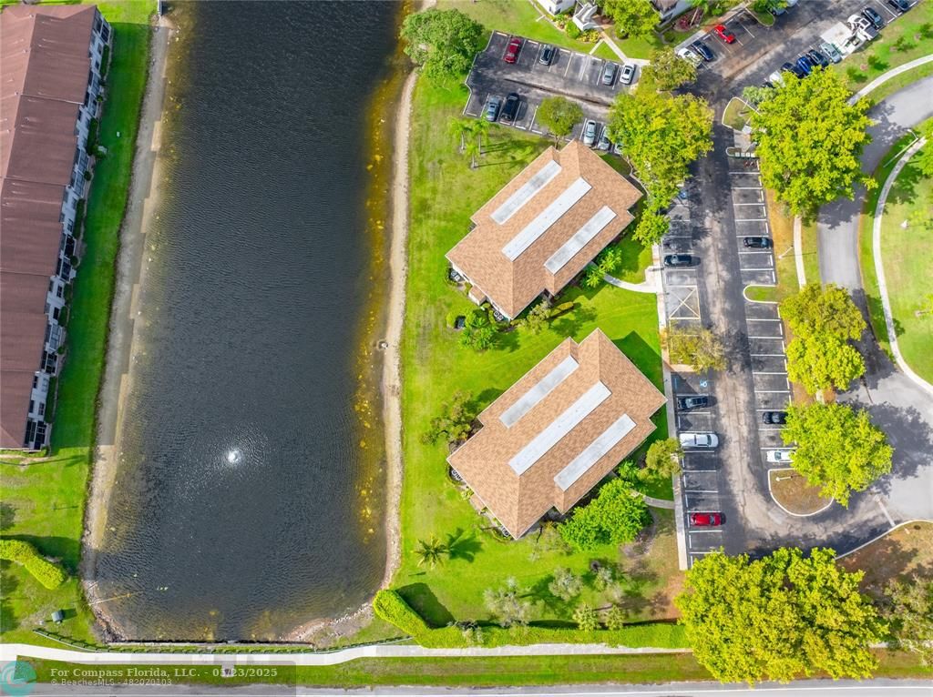 9614 West McNab Road, Unit 204 Tamarac, FL 33321 - Photo 29 of 37 a view of a yard with plants and large trees