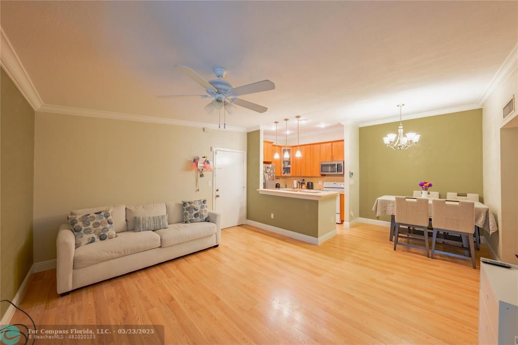 9614 West McNab Road, Unit 204 Tamarac, FL 33321 - Photo 6 of 37 a living room with furniture and kitchen view