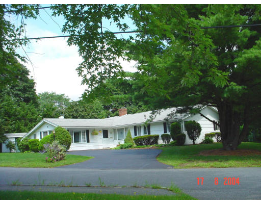29 Griffin Road Framingham, MA 01701 - Photo 1 of 14 a front view of a house with a yard and potted plants